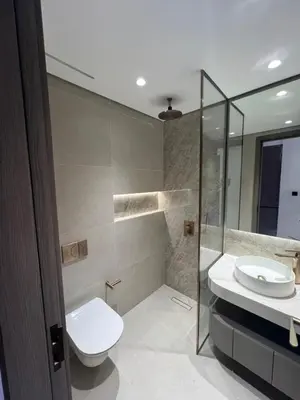 a bathroom with a toilet and a sink and a shower at Amazing Dubai Silicon Oasis Rental Apartments in Dubai