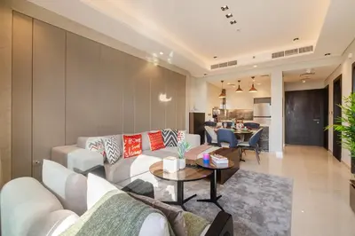 a living room with a couch and a table at BLVD - Stunning Full Burj Khalifa Firework Views in Dubai