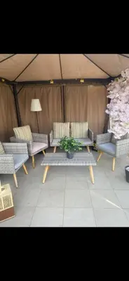 a group of chairs and a table in a tent at Holiday homes azizi riviera in Dubai