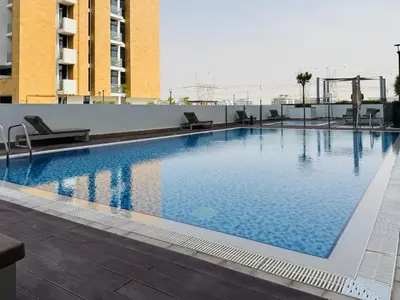 a large swimming pool on the roof of a building at Premium Guest - Dubai Riviera in Dubai