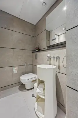 a bathroom with a sink and a toilet at Luxury Studio with Balcony in JVC in Dubai