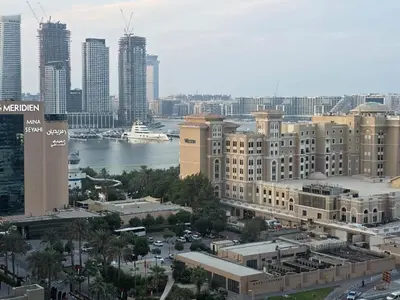 a view of a city with buildings and a harbor at Luxury Furnished 2 BR with Stunning Sea View in Dubai
