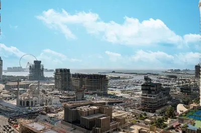 an aerial view of a city with tall buildings at StayMada - Ocean Heights Marina City and Sea Views in Dubai