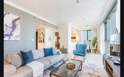 a living room with a couch and a table at Luxury 1025 sq feet 1 bed apartment in 29 floor Dubai Creek Residences in Dubai