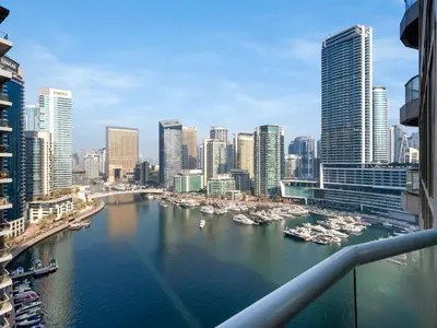 a view of a city with boats in the water at Luxury Waterfront View w Ain Dubai and PS5 in JBR 5 min from the beach in Dubai