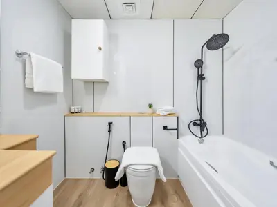 a bathroom with a white tub and a toilet at Luxury Waterfront View w Ain Dubai and PS5 in JBR 5 min from the beach in Dubai