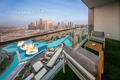 a balcony with a view of a city at Grande Tower by Emaar - Burj Khalifa and Fountain Views, Downtown Dubai in Dubai