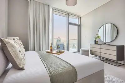 a bedroom with a large bed and a mirror at Frank Porter - Liv Marina in Dubai