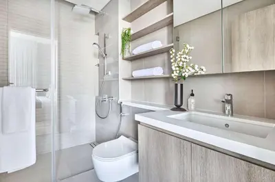 a bathroom with a sink and a toilet and a shower at Frank Porter - Liv Marina in Dubai
