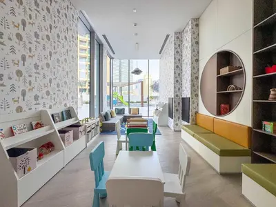 a childrens room with a table and chairs at Frank Porter - Liv Marina in Dubai