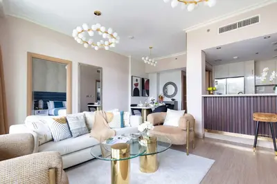 a living room with a couch and a table at Frank Porter - Burj Vista Tower 2 in Dubai