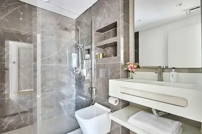 a bathroom with a toilet and a sink and a shower at Frank Porter - Marina Diamond 4 in Dubai