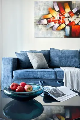 a living room with a table with a bowl of apples at Frank Porter - Marina Diamond 4 in Dubai
