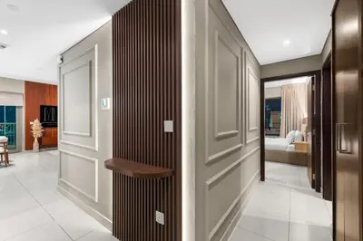 a hallway with a door and a living room at Exclusive 2BR I Panoramic Views I Downtown Dubai in Dubai