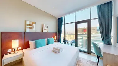 a hotel room with a bed and a large window at Séjour raffiné et inoubliable in Dubai