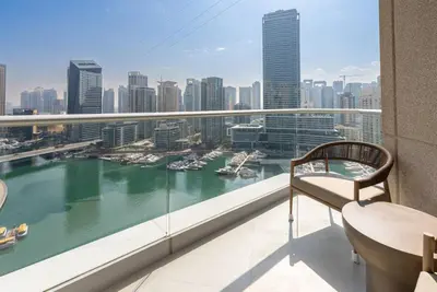 a balcony with a view of a river and buildings at 2 BR Superb and Luxury Dubai Marina View in Dubai