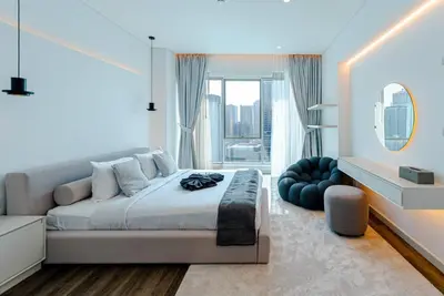 a bedroom with a large bed and a large window at 2 BR Superb and Luxury Dubai Marina View in Dubai
