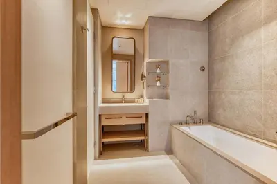 a bathroom with a tub and a sink at PVH - Downtown Magnificent 2BR - Vida Dubai Mall in Dubai