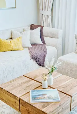 a living room with a coffee table and a couch at PVH - Downtown Magnificent 2BR - Vida Dubai Mall in Dubai