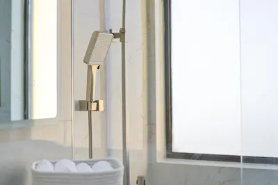 a bathroom with a sink with a hair dryer next to a mirror at 2 Bedroom Apartment, JBR Beach with Dubai Eye View in Dubai