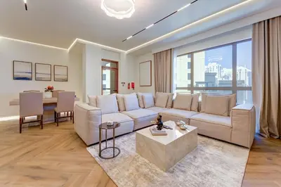 a living room with a couch and a table at 2 Bedroom Apartment, JBR Beach with Dubai Eye View in Dubai