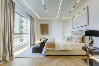 a bedroom with a bed and a large window at 2 Bedroom Apartment, JBR Beach with Dubai Eye View in Dubai