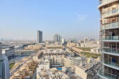 an aerial view of a city with tall buildings at Elegant Luxury Studio 12th Floor Sky high View in Dubai