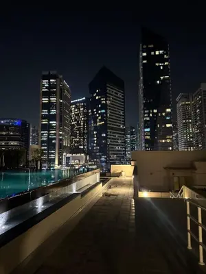 a view of a city skyline at night at Fantastic 1 bed apt near Marina & Jumeira Beach in Dubai