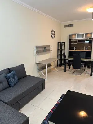 a living room with a couch and a table at Fantastic 1 bed apt near Marina & Jumeira Beach in Dubai