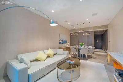 a living room with a couch and a dining room at FIVE Palm-Private Pool and Garden-Luxury Suite in Dubai