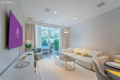 a living room with a couch and a table at FIVE Palm-Private Pool and Garden-Luxury Suite in Dubai