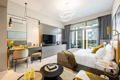 a bedroom with a king sized bed and a kitchen at Minutes Walk To Dubai Mall Studio With All Comfort in Dubai