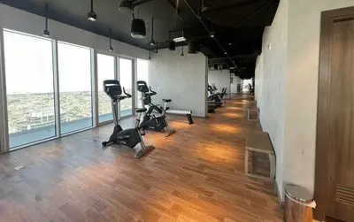 a gym with treadmills and exercise bikes in a room at 1-Bedroom Apartment near Dubai Frame High Floor in Dubai