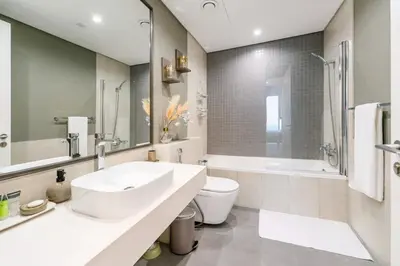 a bathroom with a sink and a tub and a toilet at 1-Bedroom Apartment near Dubai Frame High Floor in Dubai