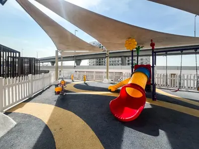 a playground with a slide in a building at Gemz by Danube with Private Pool - Onelink in Dubai