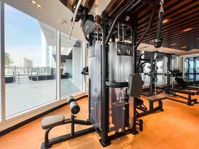 a gym with treadmills and exercise equipment in a building at Gemz by Danube with Private Pool - Onelink in Dubai