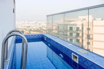 a swimming pool on the roof of a building at Gemz by Danube with Private Pool - Onelink in Dubai
