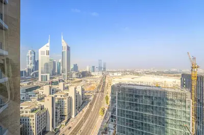 an aerial view of a city with tall buildings at Silkhaus Deluxe 1BR Stay in Sky gardens in DIFC in Dubai