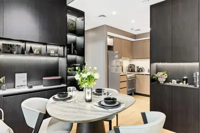 a kitchen and dining room with a table and chairs at Ultra Luxury! Burj Crown ! 1BR ! Beautiful View in Dubai