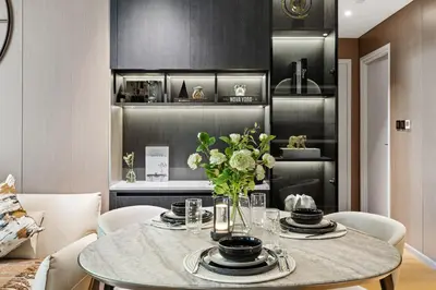 a dining room with a table with a vase of flowers at Ultra Luxury! Burj Crown ! 1BR ! Beautiful View in Dubai