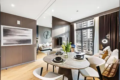 a living room with a table and chairs at Ultra Luxury! Burj Crown ! 1BR ! Beautiful View in Dubai