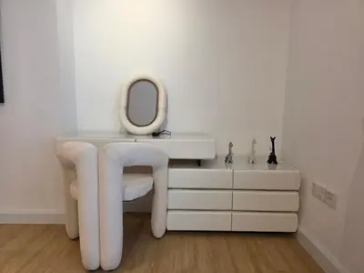 a dressing table with a mirror and a white stool at Spacious 2BR Apartment Rimal 1 JBR EB in Dubai