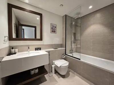 a bathroom with a sink and a toilet and a shower at Luxury Sea View Palace Beach Residence by Emaar in Dubai
