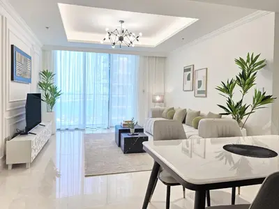 a living room with a couch and a table at Luxury Sea View Palace Beach Residence by Emaar in Dubai