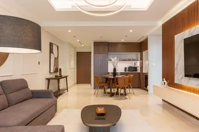 a living room with a couch and a table at Chic 1BR Sea View, Palace Beach Residence in Dubai