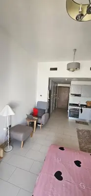 a living room with a couch and a table at Peace Home in Dubai