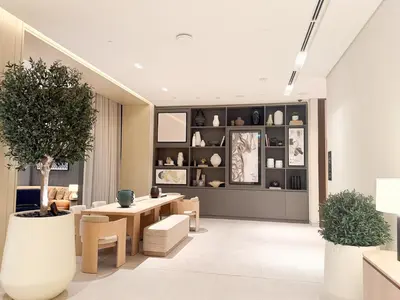 a living room with a table and chairs at 18 Vida Dubai Mall Newly Furnished 1 bedroom in Dubai