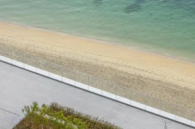 an overhead view of a beach and the ocean at Luxury Branded Suite with Direct Private Beach Access & Sea Views in Dubai