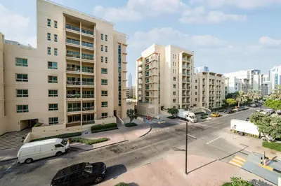 an aerial view of a city street with tall buildings at Upgraded Serene 1BR Retreat in The Greens in Dubai