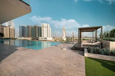 a swimming pool with a view of a city at Luxury Studio with Private Jacuzzi in Business Bay in Dubai